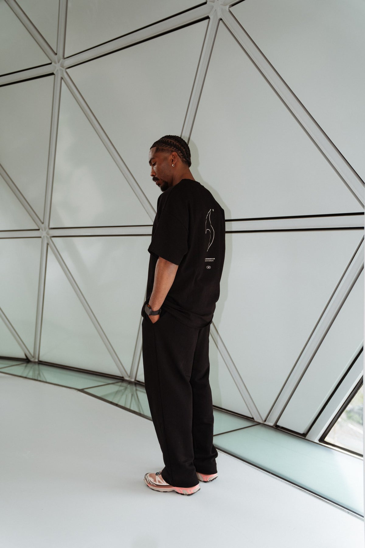 MANA SPC track pants in black, side
